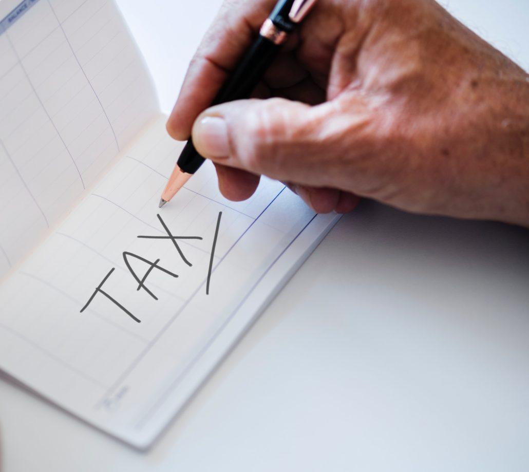 Hand writing payment owed for taxes