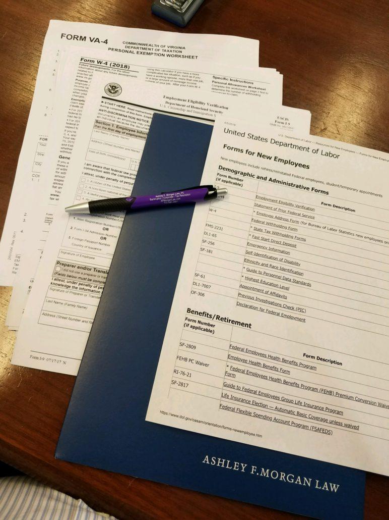 Package of documents for new hire.