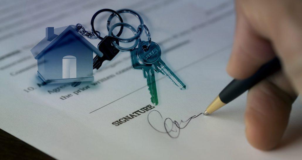 Signing closing documents with house keychain
