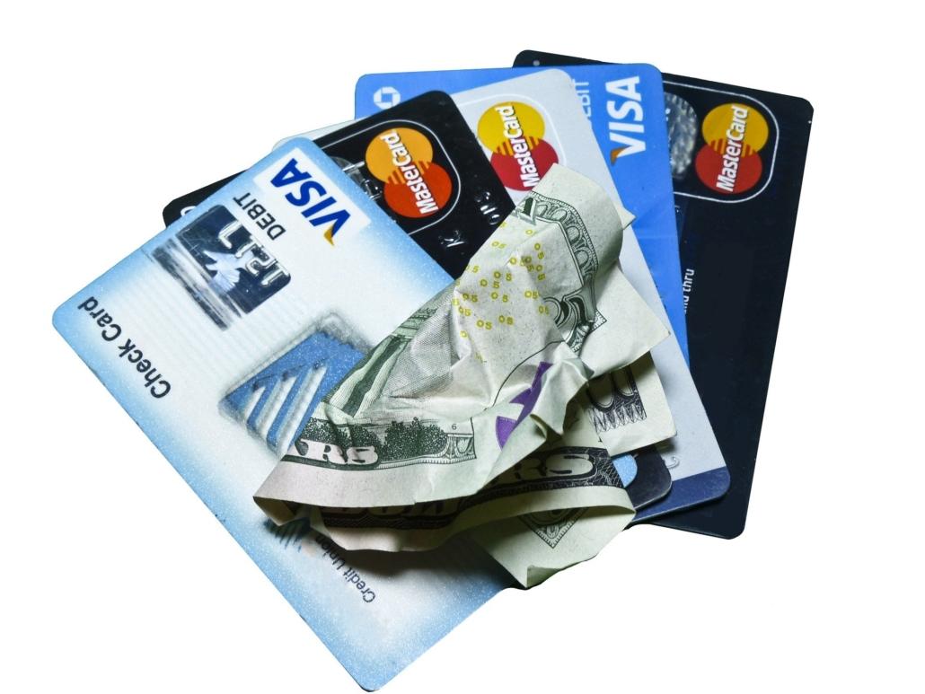 Stack of Credit Cards -- using cash to settle credit card debt is what debt consolidation companies do.